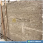 Dark beige Travertine Slabs on display in factory