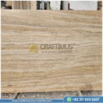 Dark beige Travertine Slabs on display in factory