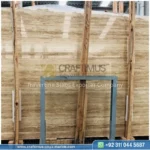 Dark beige Travertine Slabs on display in factory