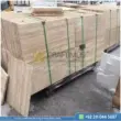 Dark beige Travertine Slabs on display in factory