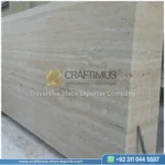 Dark beige Travertine Slabs on display in factory