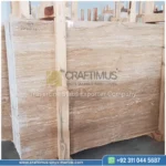 Dark beige Travertine Slabs on display in factory