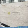 Dark beige Travertine Slabs on display in factory