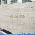 Dark beige Travertine Slabs on display in factory