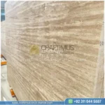 Dark beige Travertine Slabs on display in factory