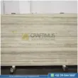 Dark beige Travertine Slabs on display in factory