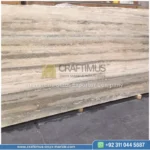 Dark beige Travertine Slabs on display in factory