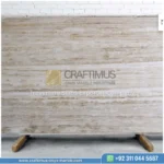 Dark beige Travertine Slabs on display in factory