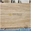 Dark beige Travertine Slabs on display in factory