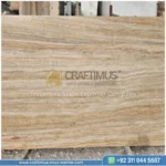 Dark beige Travertine Slabs on display in factory
