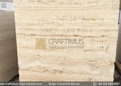 Classic Beige Travertine Blocks at a factory in Pakistan in background