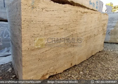 Classic Beige Travertine Blocks at a factory in Pakistan in background