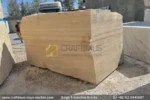 Classic Beige Travertine Blocks at a factory in Pakistan in background