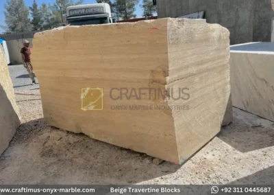 Classic Beige Travertine Blocks at a factory in Pakistan in background