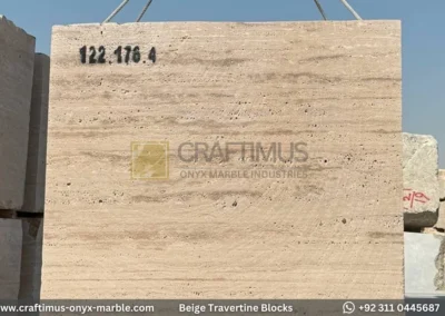Classic Beige Travertine Blocks at a factory in Pakistan in background