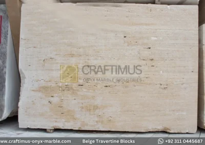 Classic Beige Travertine Blocks at a factory in Pakistan in background