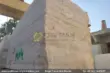 Classic Beige Travertine Blocks at a factory in Pakistan in background