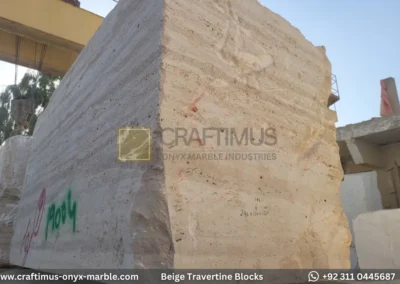 Classic Beige Travertine Blocks at a factory in Pakistan in background