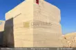 Classic Beige Travertine Blocks at a factory in Pakistan in background