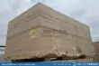 Large, textured silver travertine blocks in factory