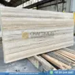 Silver Travertine Slabs Stacked in Factory