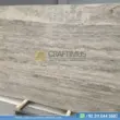 Silver Travertine Slabs Stacked in Factory