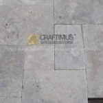 Silver Travertine Tiles on floor together for product display at stone fair