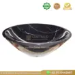 Black marble sink with elegant design and white veining, perfect for luxurious bathroom or kitchen decor.