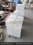 Black and gray marble vessel sink with styrofoam packaging