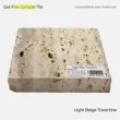 Light beige travertine tile with natural texture, suitable for various interior applications.