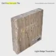 Light beige travertine tile sample with textured surface, ideal for flooring and wall applications.