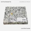 Luna Pearl Granite tile, grey with black speckles, ideal for countertops and various surface applications.