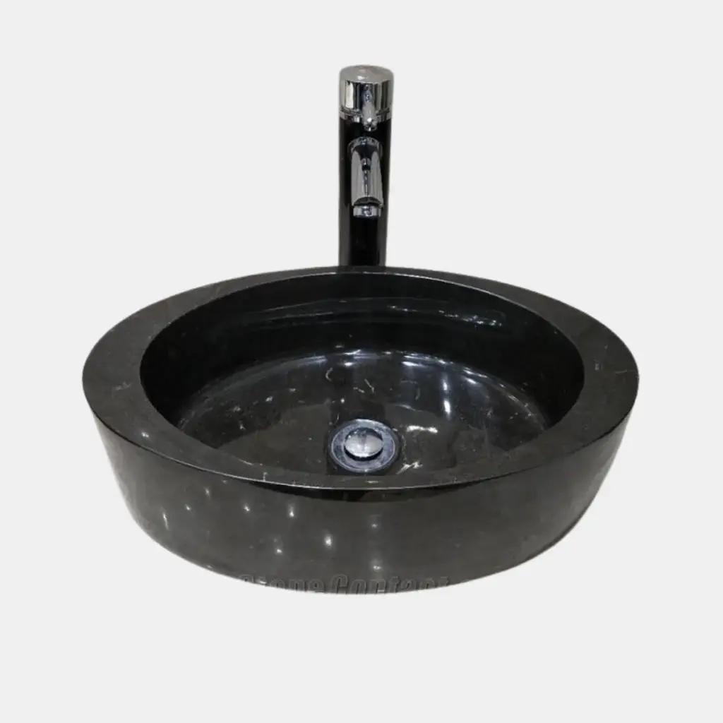 Black marble round vessel sinks with modern chrome faucet. Elegant design for stylish bathrooms.