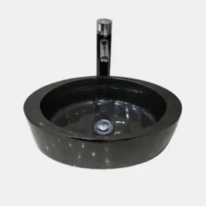 Black marble round vessel sinks with modern chrome faucet. Elegant design for stylish bathrooms.