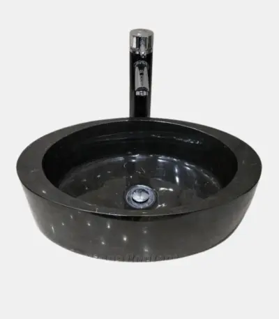 Black marble round vessel sinks with modern chrome faucet. Elegant design for stylish bathrooms.