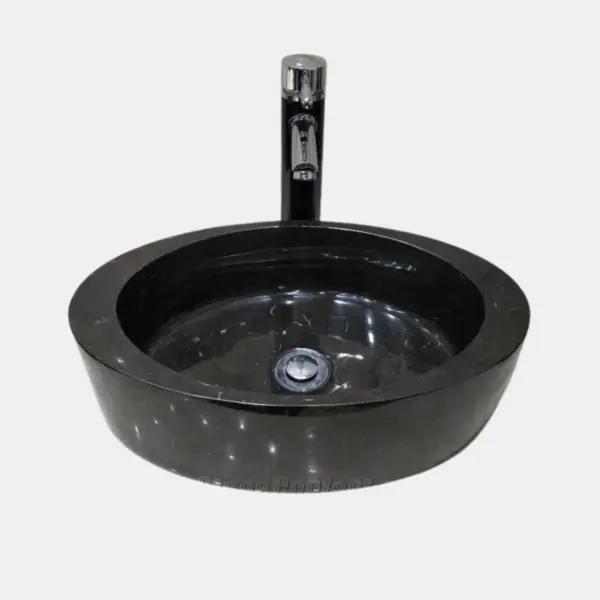 Black marble round vessel sinks with modern chrome faucet. Elegant design for stylish bathrooms.