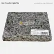 Tropical Grey Granite slab, perfect for tiles, countertops, and decorative applications. Elegant grey tones.