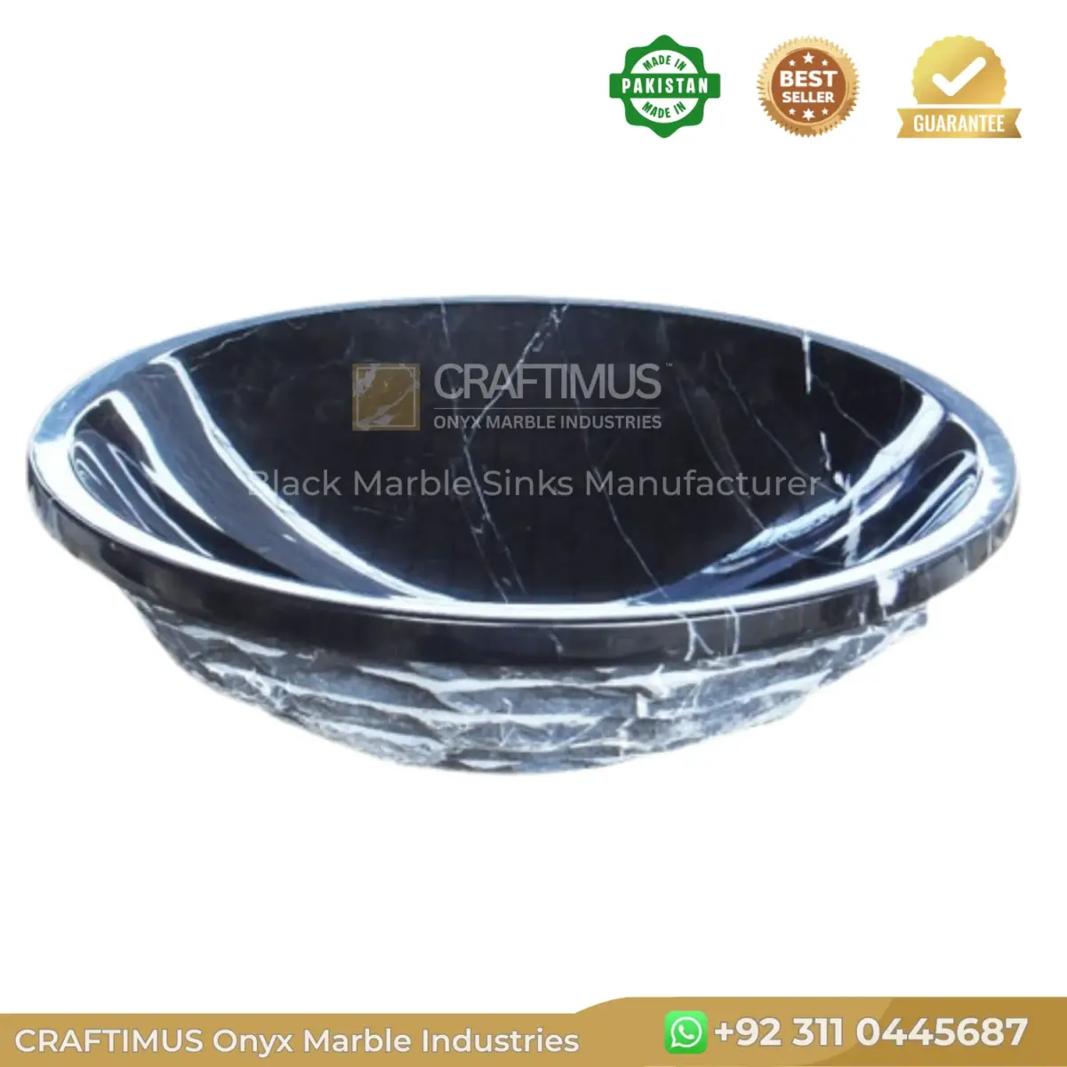 Black marble sink with elegant white veining, perfect for luxurious bathroom designs.