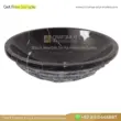 Black marble sink with natural stone finish, featuring elegant swirling patterns and a modern design.