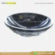 Black marble sink with elegant white veining, featuring a unique, modern design. Perfect for luxury bathrooms.