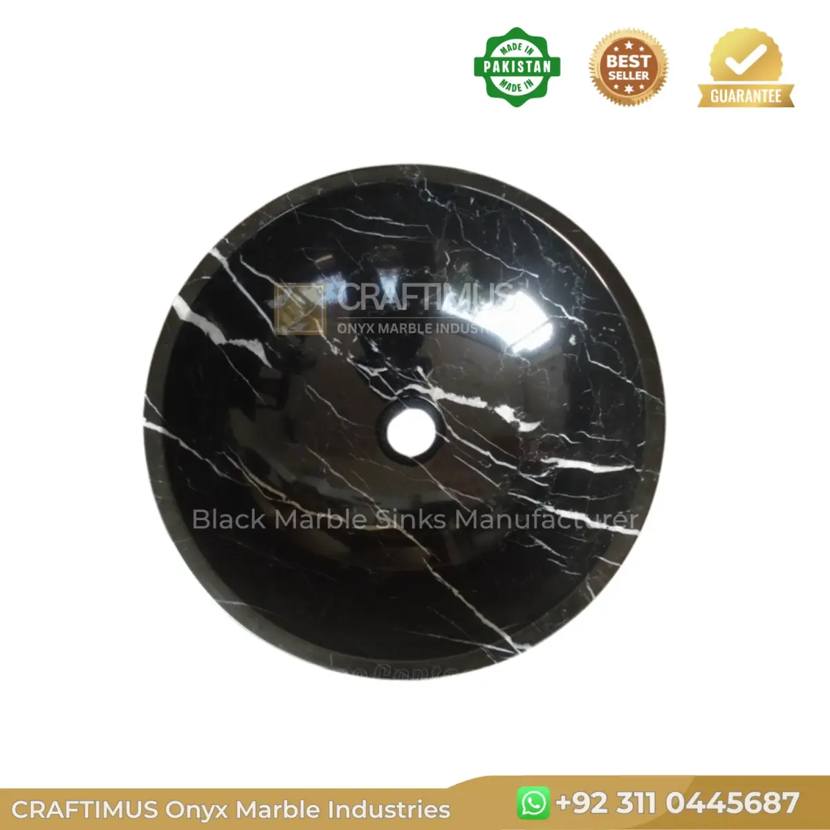 Black onyx marble sink with striking white veining, perfect for elegant bathrooms.