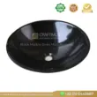 Black marble sink with a smooth finish and centered drain hole, ideal for modern bathrooms.