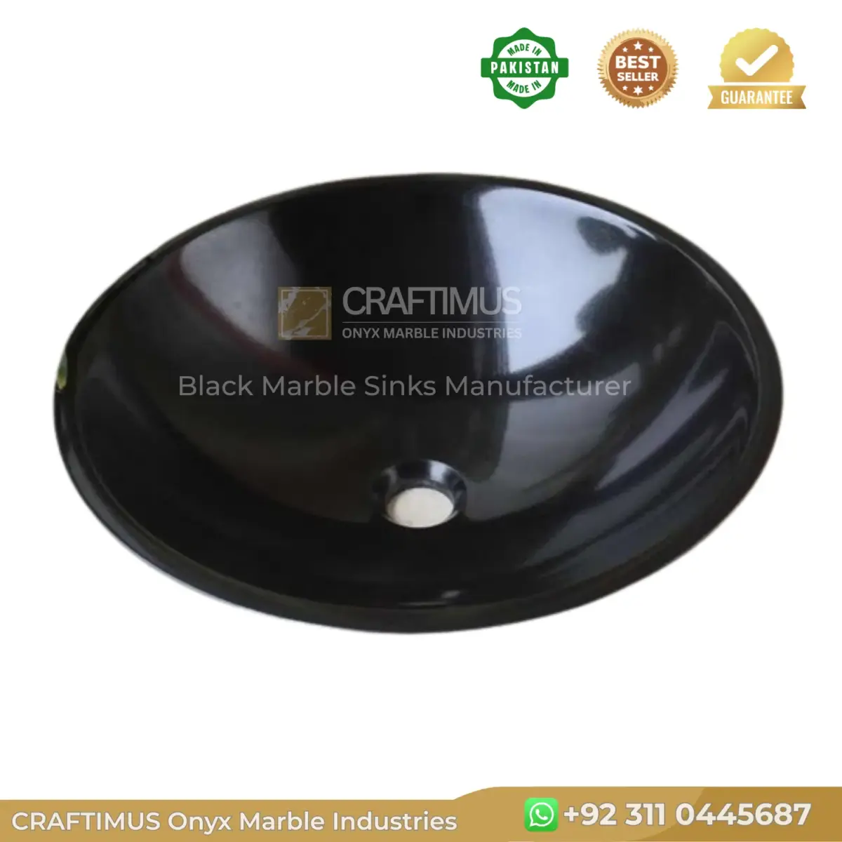 Black marble sink with a smooth finish and centered drain hole, ideal for modern bathrooms.