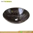 Black marble sink, elegant rounded design, perfect for modern bathrooms and luxury interiors.
