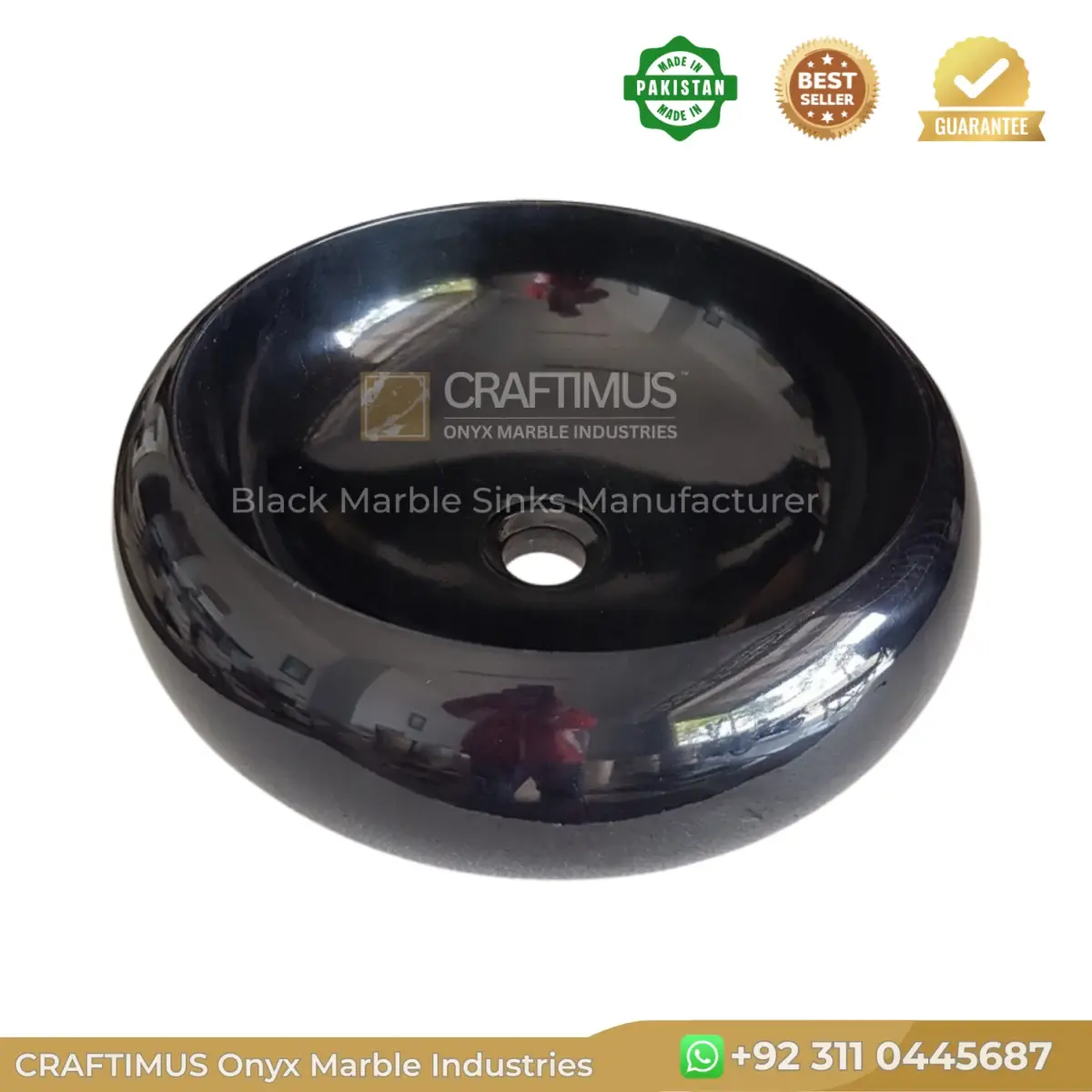 Black marble sink basin, elegant round design, perfect for modern bathrooms. Durable and stylish natural stone.
