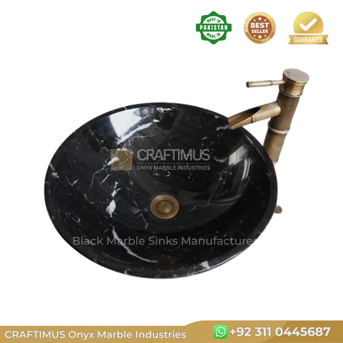 Black marble sink with gold faucet, offering elegant design and luxury for modern bathrooms.