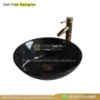 Black marble sink with a polished finish and a stylish gold faucet. Classic and elegant bathroom fixture.