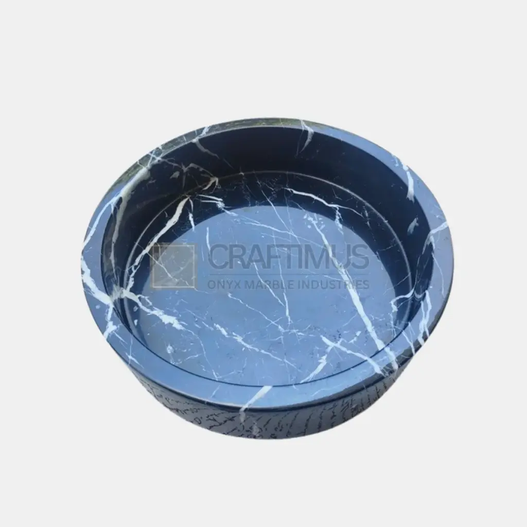 Black onyx marble bowl with white veining, perfect for decorative or functional use.